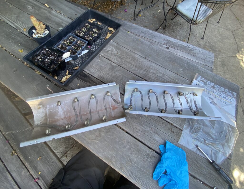 Element from an electric dryer in the process of being replaced